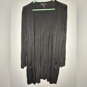 YMI women’s cardigan duster style sweater.‎ Rayon/spandex. SZ. L. Black pockets.
